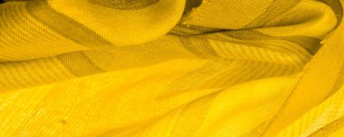 Doku. Geçmişi. Sarı renkli ipek kumaş, spektrumdaki yeşil ve turuncu arasındaki renk, maviye tamamlayıcı nitelikte birincil bir renk; olgun limon ya da yumurta sarısı gibi renklendirilmiş.