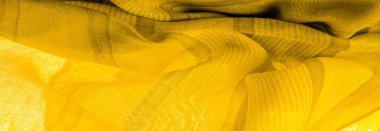 Doku. Geçmişi. Sarı renkli ipek kumaş, spektrumdaki yeşil ve turuncu arasındaki renk, maviye tamamlayıcı nitelikte birincil bir renk; olgun limon ya da yumurta sarısı gibi renklendirilmiş.