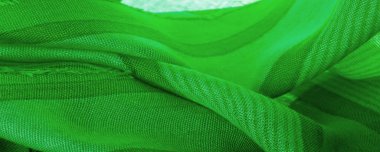 Doku. Geçmişi. İpek kumaş yeşil taze renk, spektrumda mavi ve sarı arasında renk; çimen ya da zümrüt gibi renkli.