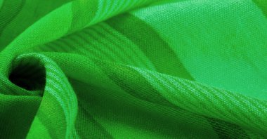 Doku. Geçmişi. İpek kumaş yeşil taze renk, spektrumda mavi ve sarı arasında renk; çimen ya da zümrüt gibi renkli.