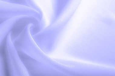 Doku. Geçmişi. açık mavi ipek kumaş. İpek böcekleri tarafından üretilen ince, güçlü, yumuşak, parlak lifler. bir yüzeyin ya da maddenin hissi, görünüşü ya da tutarlılığı.