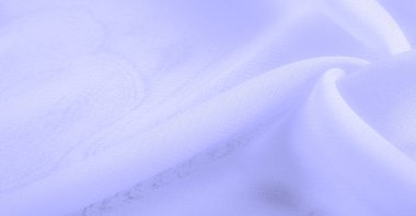 Doku. Geçmişi. açık mavi ipek kumaş. İpek böcekleri tarafından üretilen ince, güçlü, yumuşak, parlak lifler. bir yüzeyin ya da maddenin hissi, görünüşü ya da tutarlılığı.