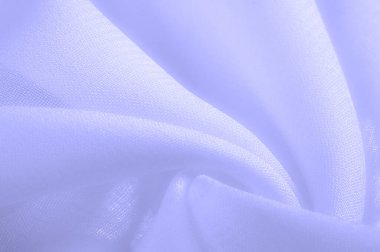 Doku. Geçmişi. açık mavi ipek kumaş. İpek böcekleri tarafından üretilen ince, güçlü, yumuşak, parlak lifler. bir yüzeyin ya da maddenin hissi, görünüşü ya da tutarlılığı.