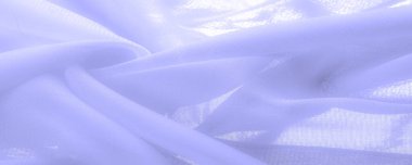 Doku. Geçmişi. açık mavi ipek kumaş. İpek böcekleri tarafından üretilen ince, güçlü, yumuşak, parlak lifler. bir yüzeyin ya da maddenin hissi, görünüşü ya da tutarlılığı.