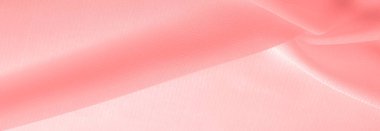 Doku. Geçmişi. kırmızı pembe ipek kumaş. İnce, güçlü, yumuşak, parlak bir lif ipek böcekleri tarafından kozalar oluşturuluyor ve iplik ve kumaş yapmak için toplanıyor..