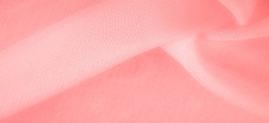 Doku. Geçmişi. kırmızı pembe ipek kumaş. İnce, güçlü, yumuşak, parlak bir lif ipek böcekleri tarafından kozalar oluşturuluyor ve iplik ve kumaş yapmak için toplanıyor..