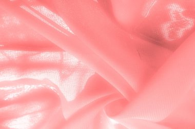 Doku. Geçmişi. kırmızı pembe ipek kumaş. İnce, güçlü, yumuşak, parlak bir lif ipek böcekleri tarafından kozalar oluşturuluyor ve iplik ve kumaş yapmak için toplanıyor..