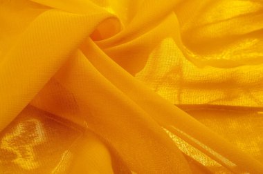 Doku. Geçmişi. Şablon. Bir yüzeyin ya da maddenin hissi, görünüşü ya da tutarlılığı. Sarı ipek kumaş