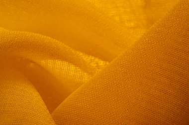 Doku. Geçmişi. Şablon. Bir yüzeyin ya da maddenin hissi, görünüşü ya da tutarlılığı. Sarı ipek kumaş