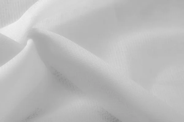 Texture. Background. the area or scenery behind the main object of contemplation, especially when perceived as a framework for it. White silk fabric