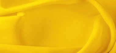 Sarı ipek kumaş, zarif, zarif, sarı saten, lüks kumaş, soyut tasarım. arkaplan dokusu, desen