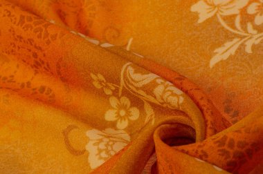 Doku, arkaplan, tasarım, kumaş, çiçek desenli turuncu ipek. Arka planda çiçek süsü bulunan renkli ipek kumaş deseni.