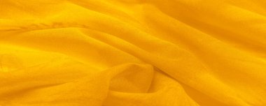 Arkaplan dokusu, sarı ipek kumaş boyalı çayır çiçekleri, spektrumda yeşil ve turuncu arasında renkler, ana çıkarıcı renk, olgun limon ya da yumurta sarısı gibi boyanmış..