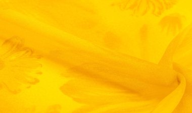 Sarı ipek kumaşlı, çiçekli, çiçekli. Renkli bir kompozisyonda bir sürü soluk çiçek. Arkaplan dokusu