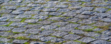 Arka plan dokusu, granit taş kaldırım, neme ve yüksek sıcaklıklara dayanıklı, mekanik hasara dayanıklı.