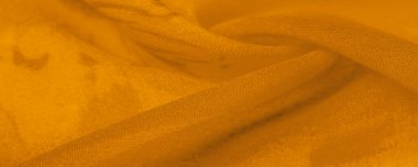 Sarı ipek kumaşlı, çiçekli, çiçekli. Renkli bir kompozisyonda bir sürü soluk çiçek. Arkaplan dokusu