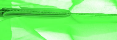 Yeşil ipek kumaş, zarif, dalgalı, yeşil saten ipek lüks kumaş, soyut tasarım. arkaplan dokusu, desen