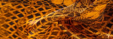 Tekstil malzemesinden kahverengi arka plan. dantel kumaş. Doğal kehribar dokusu. Doku, arkaplan, desen.