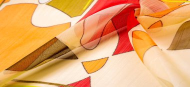 İnce örülmüş kumaş, şeffaf, kırmızı, beyaz ve sarı geometrik renkler, ince yapışkan ipekten yapılmış. Organza deseni. Doku. Arkaplan