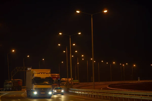 photo of the road, the night road is lit by lighting lamps, 2019-10-15 Krasnodar Territory Russia