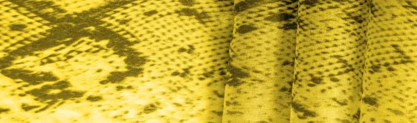 yellow fabric with a pattern of squares, background texture of bright yellow fabric close-up. background, texture, pattern,