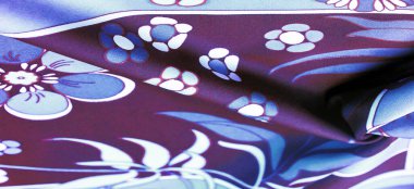 Kahverengi-mavi kumaş, beyaz çiçek desenli, geometrik çizgiler. Doku, arkaplan, desen