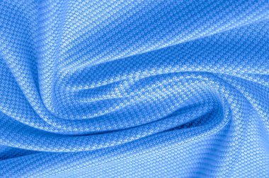 Yün kumaşın rengi mavi, süper yumuşak ve pofuduk eli ise açık bir desen. Arkaplan dokusu