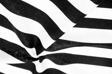 Pamuk kumaş, beyaz ve siyah çizgili. Katı lakonik tasarım. Modern geometrik arka planlar. Arkaplan dokusu