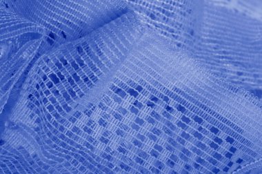 Doku, arka plan mavi tül. Bu olağanüstü naylon tülü kullanarak bir aksesuara hacim, yetenek ya da detaylı tasarım ayrıntıları ekleyin! Yumuşak tül tasarım gereksinimlerinizi karşılıyorsa, diğer kalıplara bakın