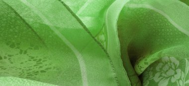 Doku, arkaplan, tasarım, kumaş, çiçek desenli yeşil ipek. Arka planda çiçek süsü olan renkli ipek kumaş deseni.