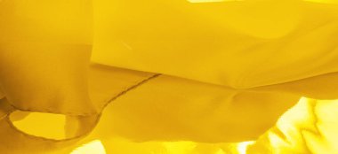 Sarı ipek kumaş, zarif, zarif, sarı saten, lüks kumaş, soyut tasarım. arkaplan dokusu, desen