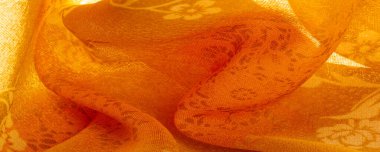 Doku, arka plan, tasarım. Çiçek desenli turuncu kumaş. Çiçekli botanik çiçekleri. Arkaplan çizimleri kümesi.