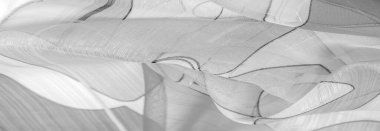 Arka plan dokusu bir organza deseni. İnce, şeffaf kumaştan bir kumaş. İnce, yapışkan ipekten bir peçe gibi. siyah ve beyaz geometrik renkler
