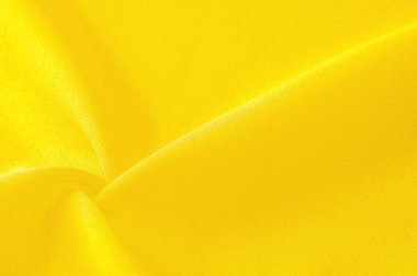 Sarı ipek kumaş, zarif, zarif, sarı saten, lüks kumaş, soyut tasarım. arkaplan dokusu, desen