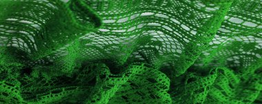 Arkaplan, doku, desen, yeşil dantel kumaş, ince açık kumaş, genellikle pamuktan ya da ipekten yapılmış, halkalar, bükme ya da örgü iplikleri kullanarak desenler halinde yapılmış.