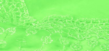 Doku, arkaplan, desen, kartpostal, ipek kumaş, dantel ambalajlı kadın bahar yeşil atkısı. Yazdırma ve dijital materyallerinizi oluşturmak için bu süslü resimleri kullanın.