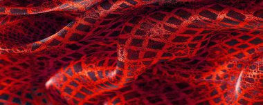 Tekstil malzemesinden kırmızı arka plan. dantel kumaş. Doğal yakut dokusu. Doku, arkaplan, desen.