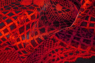 Doku, arka plan, desen. Yakut kırmızısı dantel kumaş, kırmızı ve siyah kumaşın karışımı. Kızarır, kızarır, kızarır, kızarır.