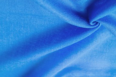 Lacivert ipek kumaş, mavi ince tahıl kumaşı. Masaüstü ürünü, görüntü perspektifi, stüdyo fotoğrafçılığı. ürün demo afişi.
