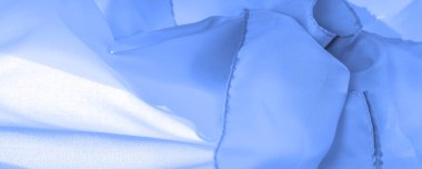 Mavi ipek kumaş, zarif dalgalı mavi saten, lüks kumaş, soyut tasarım. arkaplan dokusu, desen