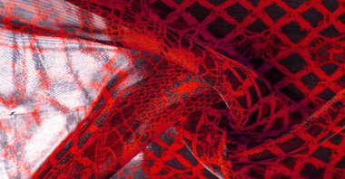 Tekstil malzemesinden kırmızı arka plan. dantel kumaş. Doğal yakut dokusu. Doku, arkaplan, desen.