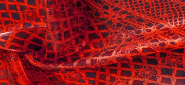 Tekstil malzemesinden kırmızı arka plan. dantel kumaş. Doğal yakut dokusu. Doku, arkaplan, desen.