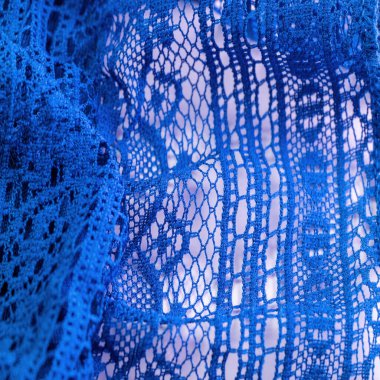 Mavi dantel kumaş, çiçekli mavi dantel kumaş. Tekstil arka planında dikişsiz desen, arka plan dokusu, desen..