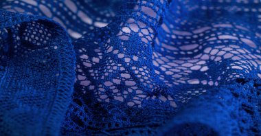 Mavi dantel kumaş, çiçekli mavi dantel kumaş. Tekstil arka planında dikişsiz desen, arka plan dokusu, desen..