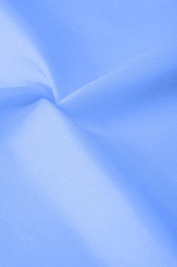 Mavi ipek kumaş, zarif dalgalı mavi saten, lüks kumaş, soyut tasarım. arkaplan dokusu, desen