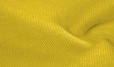 Sarı yün kumaş. Amber sarısı keçeli kumaş, soyut sanat. Arkaplan dokusu, desen