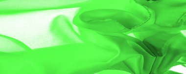 Yeşil ipek kumaş, zarif, dalgalı, yeşil saten ipek lüks kumaş, soyut tasarım. arkaplan dokusu, desen