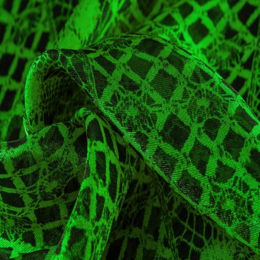 Yeşil dantel kumaş, yeşil ve siyah kumaşın karışımı. Zümrüt, doku, arkaplan, şekil.