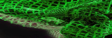 Yeşil dantel kumaş, yeşil ve siyah kumaşın karışımı. Zümrüt, doku, arkaplan, şekil.