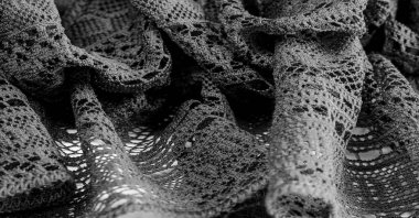 Siyah dantel kumaş, seksi retro gecelik kumaşı. Klasik iç çamaşırı süsü. arkaplan dokusu, desen.